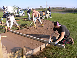 The crew pouring a sidewalk.